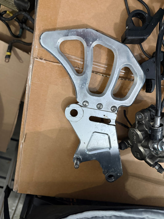 polished surron ultra brake bracket